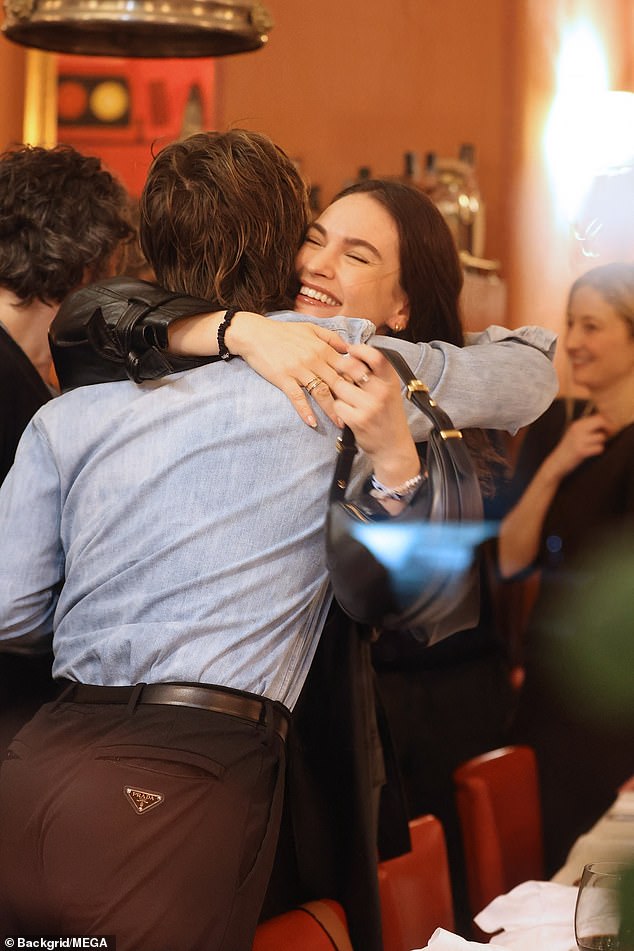 Lily James and Stranger Things star Joe Keery smiled and hugged each other as they dined together at Dal Bolognese restaurant in Rome on Sunday