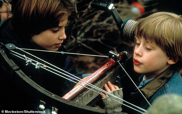 The couple experiments with a crossbow, which Henry uses to shoot a dog that barks at him