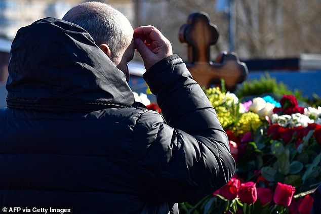 Grave after dozens of supporters were arrested for attending the Putin critic's funeral.  Defiant mourners have braved the fury of the Russian state, which arrested nearly 70 people across Russia for daring to mourn the loss of the opposition leader